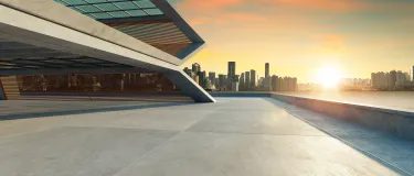 sunset city skyline showing modern concrete building