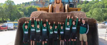 Cauldon 65th anniversary event local children standing in front loader