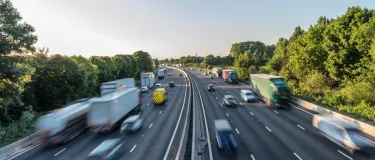 Asphalt motorway with fast moving traffic