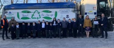 A Witherley Services truck carrying a positive eco message designed by a 10-year-old schoolboy following a competition