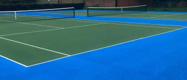 A view of the finished SuperSport Tennis court at Wolf Fields