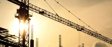 construction-development skyline-sunrise setting with crane.png
