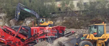 Heavy plant machinery including a digger and shovel in operation at OCL Regeneration depot