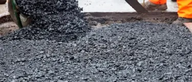 Asphalt being laid on a utilities job.jpg