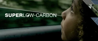 Girl looking out of a car window with the Superlow-Carbon logo over the top and a graphic on the right. Banner.