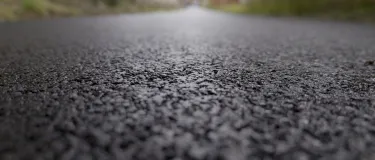 Extreme closeup of the new asphalt path laid at Waterhouses, Staffordshire