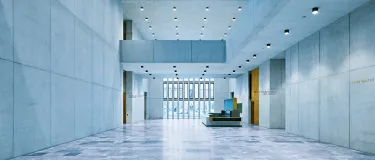 Lobby of the Kunsthaus building in Zurich with a blue hue