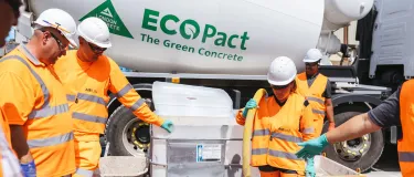 Foam concrete Airium Voidfill and Airium Roadfill is launched in the UK. An operative in high vis clothing is pumping the product from the mixer truck into a tub while colleagues watch on.