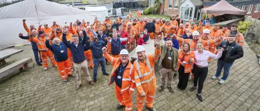 Graham Robinson and Ian White celebrate 50 years service at Bardon Hill Quarry with colleagues around them