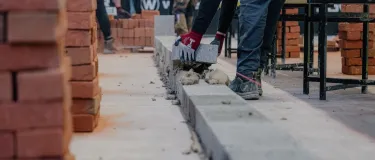 A contestant handling a Holcim block at a regional Super Trowel event. Holcim UK is one of the event sponsors.