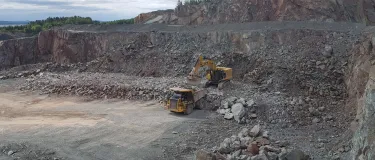 Heavy machinery extracting rock from the quarry