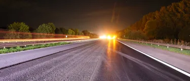 The M5 motorway at night with vehicle lights in the distance