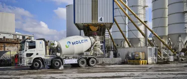 A Holcim UK mixer truck being filled with biochar coffee concrete at its Battersea Readymix plant in London