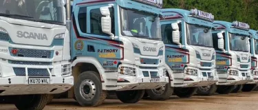 P J Thory lorries lined up in a row at their Coates HQ. The company has been acquired by Holcim.