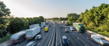 looking over a busy motorway, vehicles with motion blur