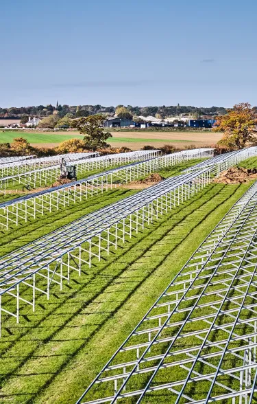 Field filled with solar panel frames