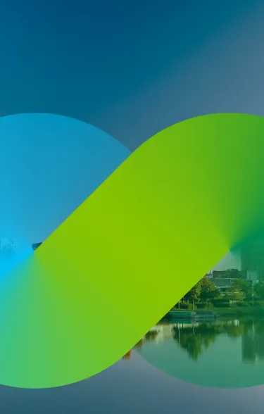 City skyline reflected in water with a blue/green figure eight swirl in front