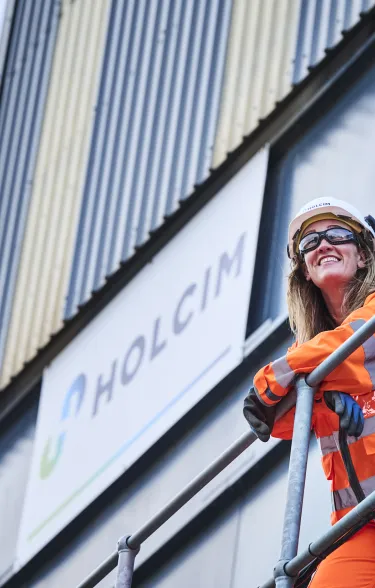 Lady in high viz PPE standing on a platform at Holcim's Coleshill readymix plant