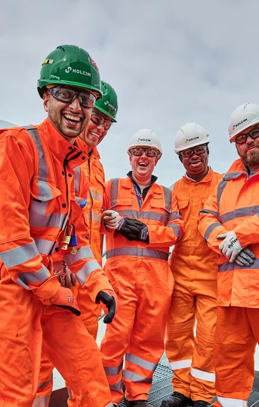 Members of Holcim UK's Tilbury site posing for a team phoot weatring full PPE.