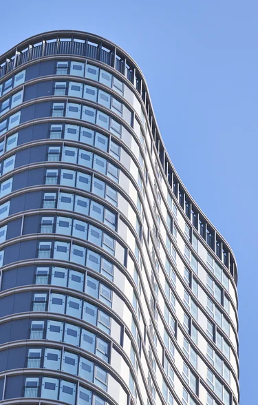 View looking up at wood wharf building