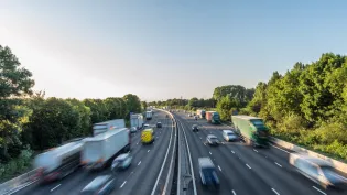 Asphalt motorway with fast moving traffic