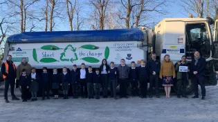 A Witherley Services truck carrying a positive eco message designed by a 10-year-old schoolboy following a competition