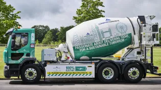 A side on view of an electrically powered concrete mixer with London Concrete branding on. It will be the first e-mixer to operate in London.