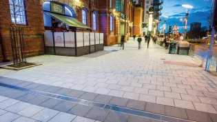 Charcon Appalachian concrete flag paving displayed on a project in woodgate in stevenage at night