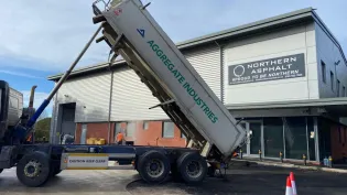 A tipper truck depositing SuperCurve asphalt into the carpark at Northern Asphalt