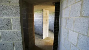 Building walls showing exposed concrete blocks