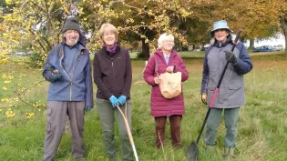 Community volunteers with gardening equipment ahead of planting spring flowering  bulbs donated by Holcim UK 