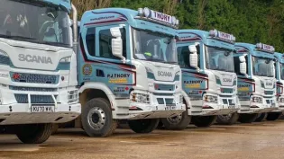 P J Thory lorries lined up in a row at their Coates HQ. The company has been acquired by Holcim.