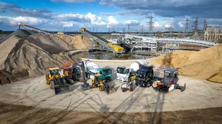 Electric vehicles from Holcim UK and Tarmac at the Tilbury site which is serving material supply to the Lower Thames Crossing project.