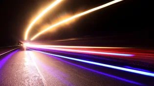 The M5 motorway at night with vehicle lights in the distance