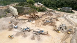 An aerial shot of Moorcroft Quarry in Plymouth including solar panels on the maintenance workshop roof.