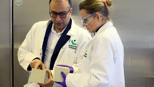 Holcim's Veronika Elfmarkova exaines a concrete block in Vateris' lab in Nottingham with with company co-founderDr Sid Pourfalah