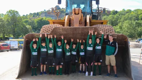 Cauldon 65th anniversary event local children standing in front loader
