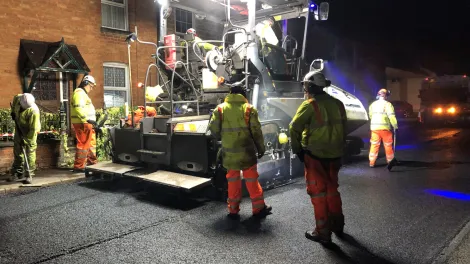 An Aggregate Industries paver laying an asphalt with the Gipave additive as part of a trail with Milestone and Oxfordshire County Council