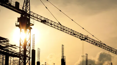 construction-development skyline-sunrise setting with crane.png