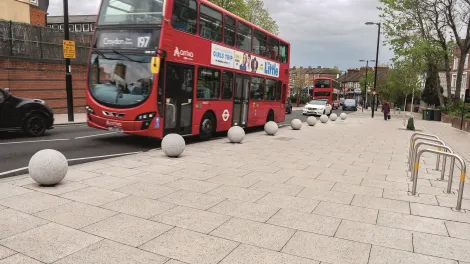 A header image for Charcon's Ultrapave paving laid in london featuringa london bus 