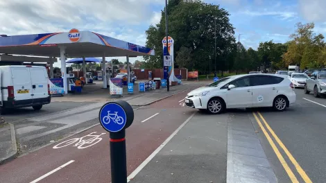 The Charcon dutch cycle kerb laid at a busy crossing across a cycle path the enter a petrol station along coundon road in coventry