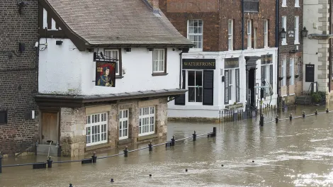 Typical UK town with it's main-street flooded up to the top of railings