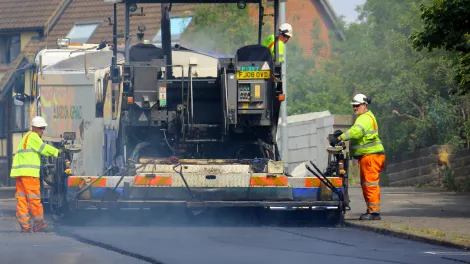 Road asphalt resurfacing in a residential area