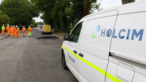 A Holcim van overlooks a road in Coventry which is part of a scheme trialing the use of low carbon and innovation surfacing materials.