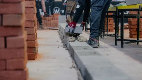 A contestant handling a Holcim block at a regional Super Trowel event. Holcim UK is one of the event sponsors.