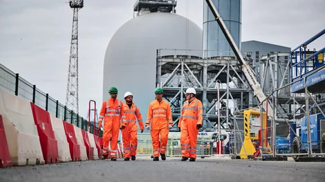 Members of the Holcim UK Tilbury team walking on site in PPE