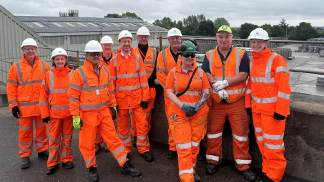 Representatives from Aggregate Industries, Regerco and Aniron after the completion of a new solar panel installation project at Hulland Ward