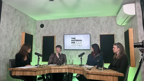 Members of the panel taking part in Holcim's The Material Mix podcast in a broadcasting studio.