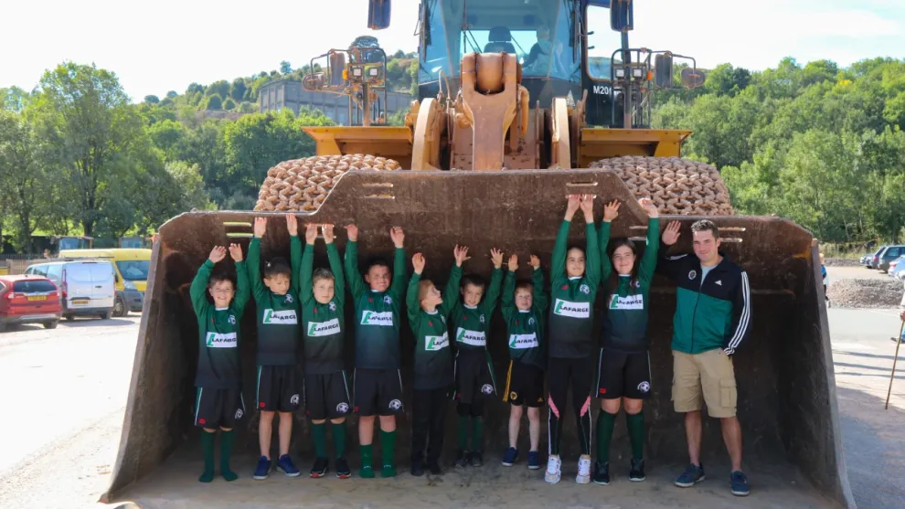 Cauldon 65th anniversary event local children standing in front loader