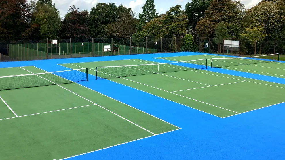 Looking over three newly laid tennis courts at Oakhill